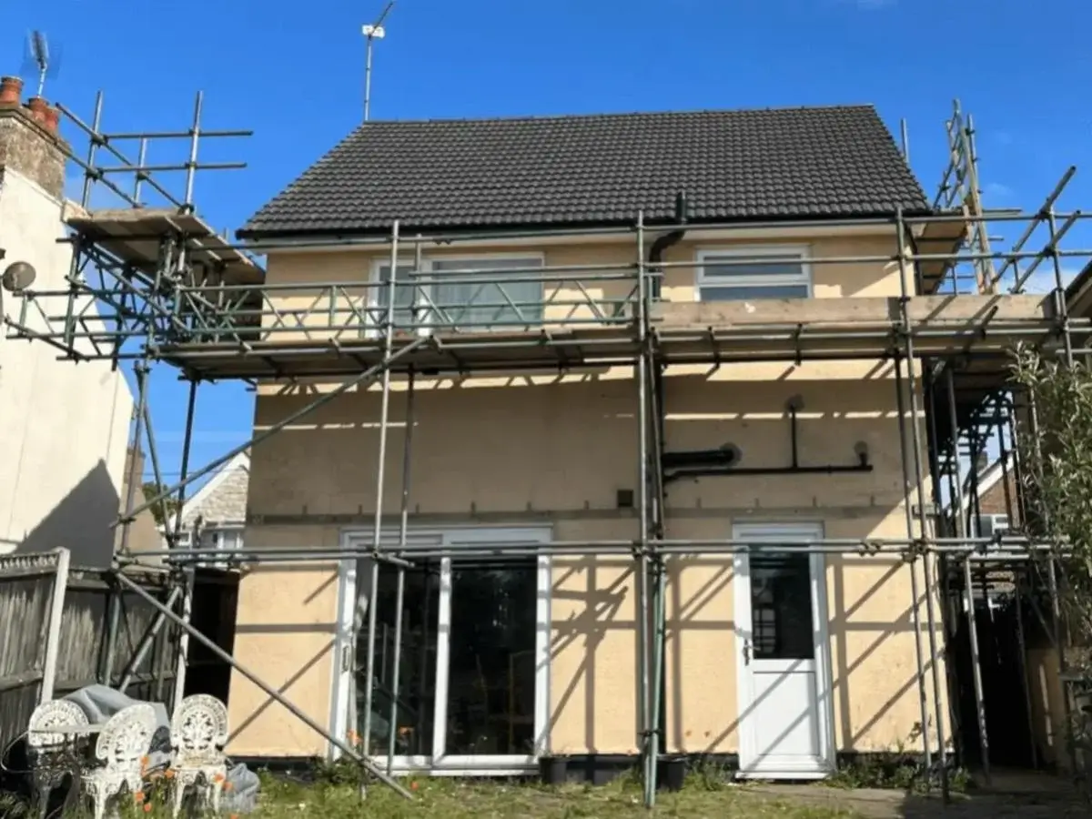 Safe structural scaffolding erected around a detached home for a full pitched re-roofing project by Norfolk Exterior Solutions